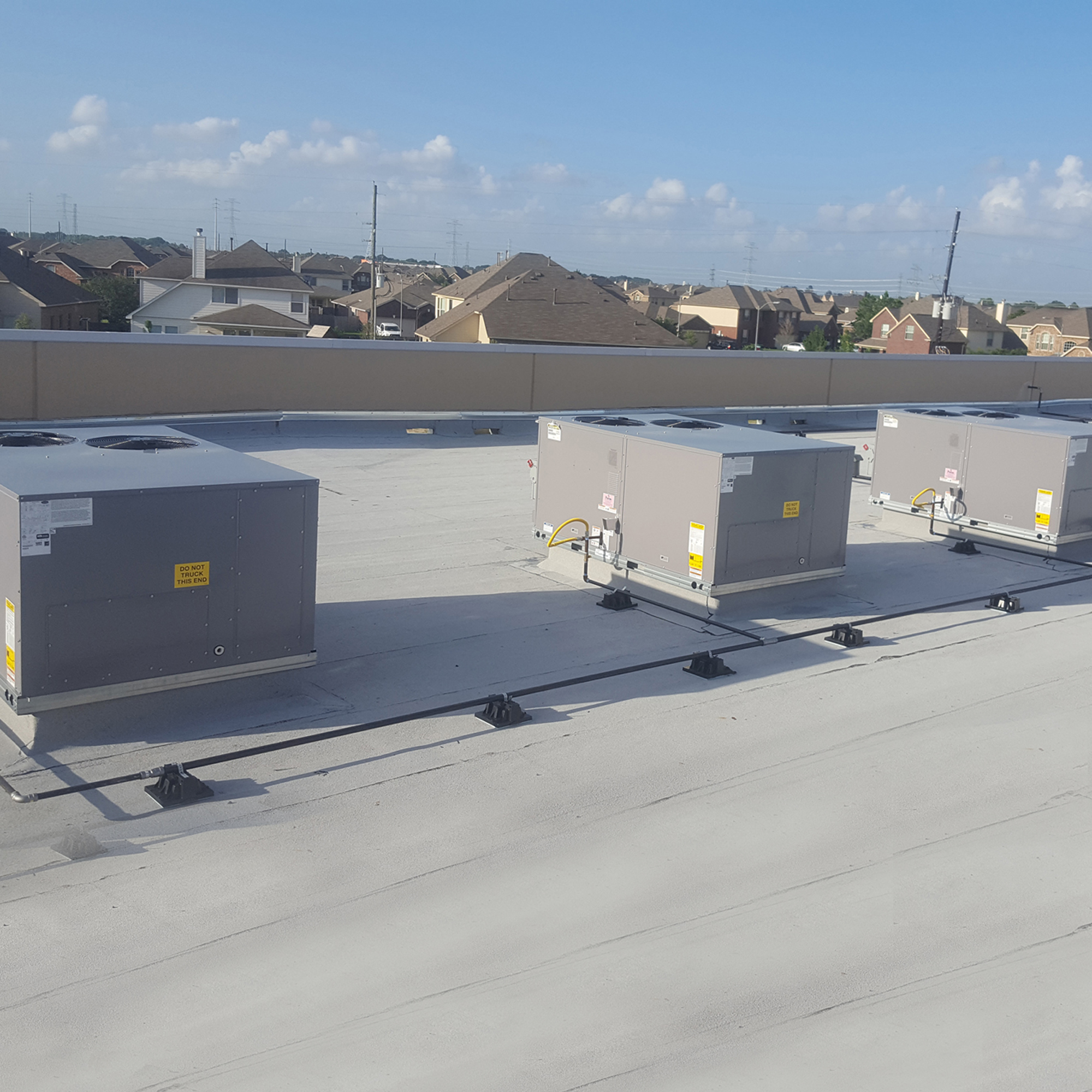 A view of some air conditioners on the roof.