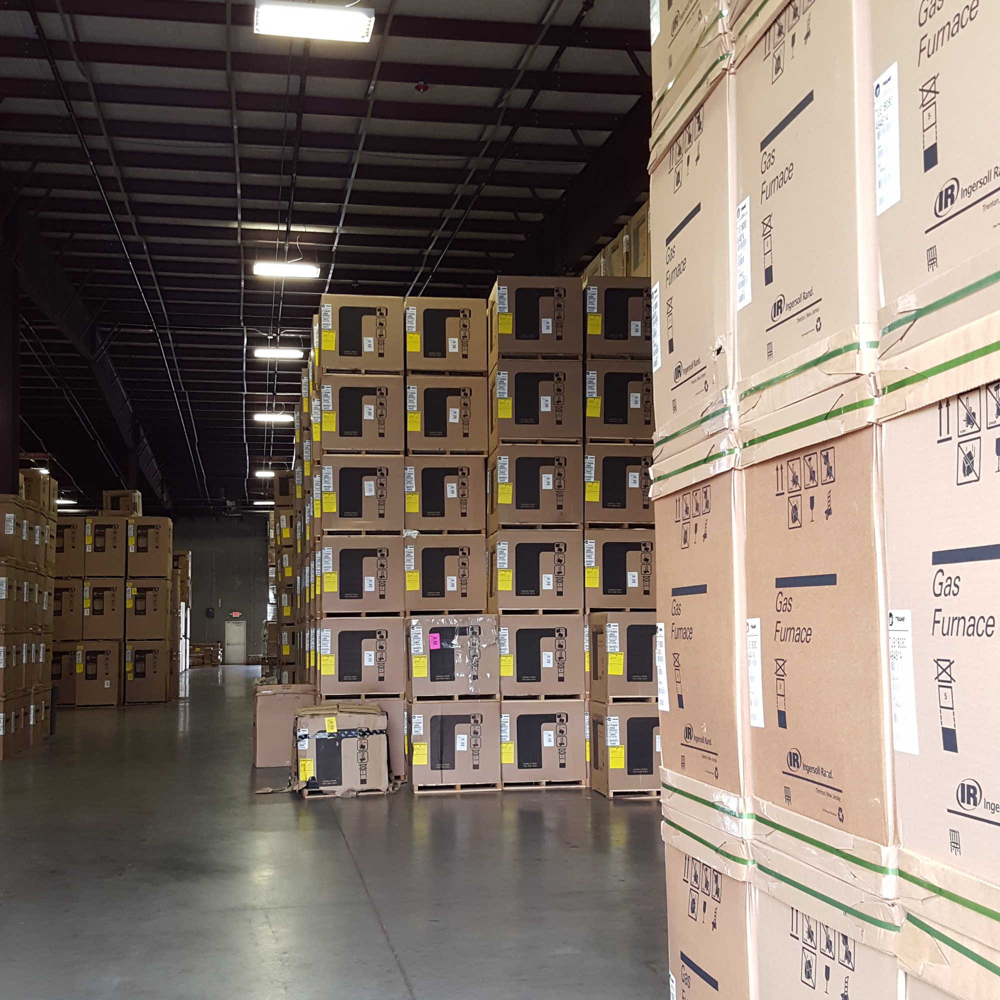 A warehouse filled with boxes of computers.