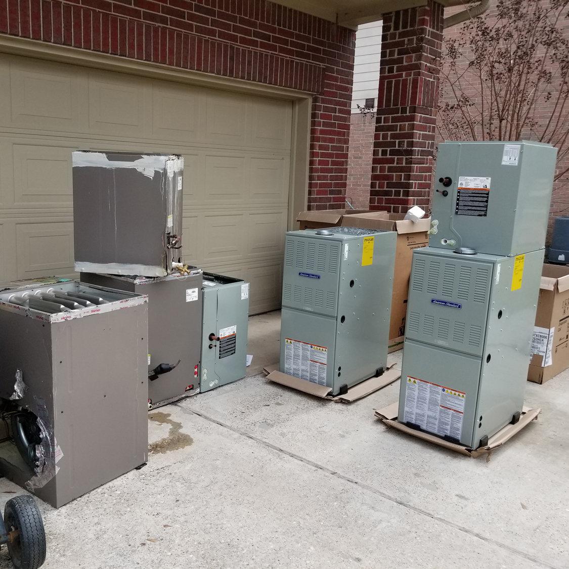 A group of metal boxes sitting on top of pallets.